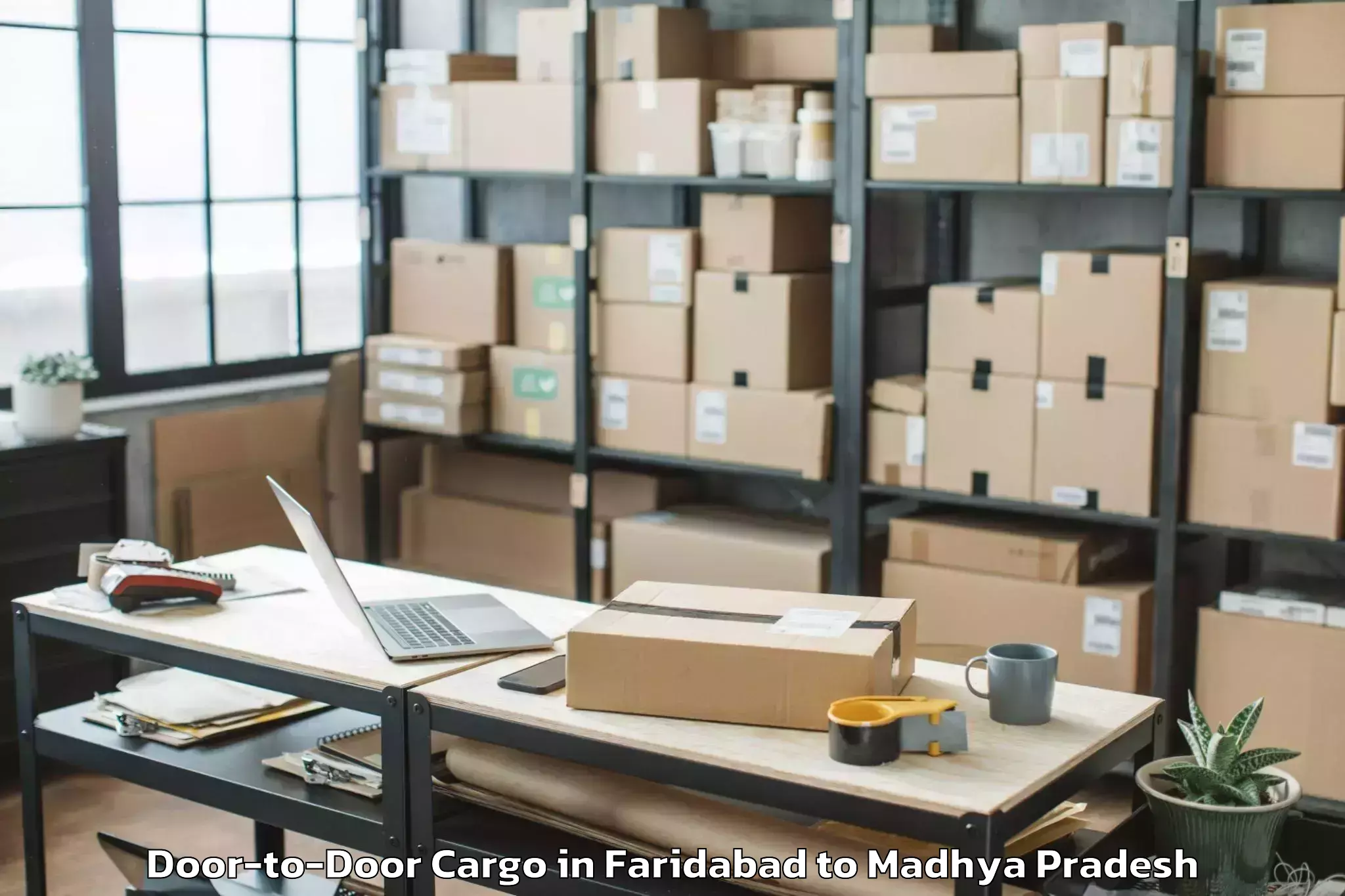 Easy Faridabad to Sage University Indore Door To Door Cargo Booking